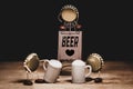 Crown cork miniature figures with beer jugs and a standee billboard, english word beer and a heart symbol