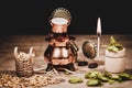 Crown cork miniature figures with hop cones, barley and a brewing copper kettle, concept beer brewery Royalty Free Stock Photo