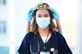 Crown, face mask and portrait of a woman nurse with an award, achievement or promotion in the hospital. Success