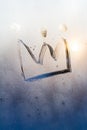 Crown icon isolated on blue sunny misted glass background. Emperor treasure. Close up covid symbol