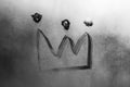 Crown isolated on gray misted glass background. Emperor treasure. Close up covid symbol