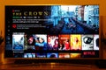 The Crown - Netflix television screen with popular series choice. Movies Royalty Free Stock Photo