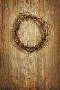 Crown of thorns on grunge wood background