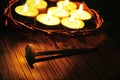 The crown of thorns on the holy cross and some lit candles, with Royalty Free Stock Photo