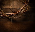 A crown of thorns on a wooden background. Easter Theme Royalty Free Stock Photo