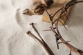Crown of thorns, wooden plank and hammer with nails on sand. Easter attributes Royalty Free Stock Photo