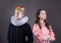 Crowned boy ignores the girl. Royalty Free Stock Photo