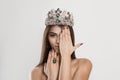 Crowned dark beauty queen. Brunette woman fashion model