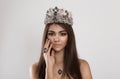 Crowned dark beauty queen. Brunette woman fashion model