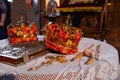 Crowns for weddings in orthodox church. Attributes - gold crowns, golden cross, bible, candles, church altar. Royalty Free Stock Photo