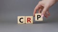 CRP - C-Reactive Protein Test symbol. Wooden cubes with word CRP. Doctor hand. Beautiful grey background. Medical and C-Reactive Royalty Free Stock Photo