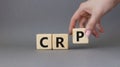 CRP - C-Reactive Protein Test symbol. Wooden cubes with word CRP. Doctor hand. Beautiful grey background. Medical and C-Reactive Royalty Free Stock Photo
