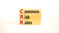 CRR common risk rules symbol. Concept words CRR common risk rules on wooden blocks on a beautiful white table, white background. Royalty Free Stock Photo