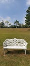 White Iron bench, Grass texture blue sky