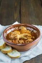 Crubeens with tomato sauce and bread