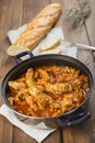 Crubeens with tomato sauce and bread