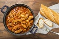 Crubeens with tomato sauce and bread