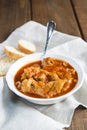 Crubeens with tomato sauce and bread