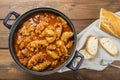 Crubeens with tomato sauce and bread