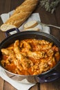 Crubeens with tomato sauce and bread