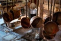 Crucible ladles hang from a rack