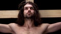 Crucified son of God looking up, religious self-sacrifice, bible history, belief Royalty Free Stock Photo