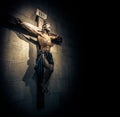 Crucifix in church on the stone wall. Royalty Free Stock Photo