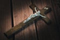 Crucifix close up on wooden background Royalty Free Stock Photo