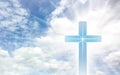 Crucifix cross on beautiful sky with sunbeam. Holy cross of Jesus christ on clouds background Royalty Free Stock Photo