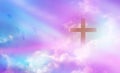 The crucifix floats in the sky with the light shining as hope, love and freedom in the sky background. Royalty Free Stock Photo