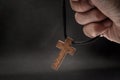 The crucifix is in the hands of a man who is praying for the blessing of his god with faith Royalty Free Stock Photo