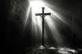 A crucifix illuminated by rays of light in a dark room, signifying divine presence Royalty Free Stock Photo