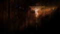 Jesus on the cross in church with ray of light in the darkness Royalty Free Stock Photo