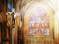 Crucifix, Jesus on the cross in church with ray of light from stained glass. 3d rendering Royalty Free Stock Photo