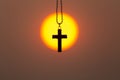The crucifix in the middle of the rising sun or the setting sun, the concept of Christianity, the blessing of praying to Jesus