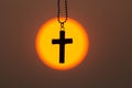 The crucifix in the middle of the sunrise or sunset. The concept of Christianity, a blessing from prayer to Jesus. Belief in God,