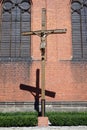 Crucifix near the brick wall