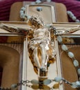 Crucifix and rosary beads of Catholic religion closeup