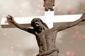 Crucifix in sepia colors with red hearts and wounds on Christ