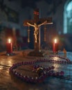 Crucifix sits on table next to two red candles Royalty Free Stock Photo