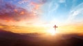 The crucifix symbol of Jesus on the mountain sunset sky background