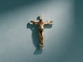 Crucifix on wall in spotlight inside old dark church or cathedral. Jesus Christ on cross. Religion, belief and hope Royalty Free Stock Photo