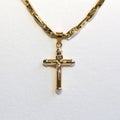 Crucifix in yellow gold Royalty Free Stock Photo