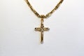 Crucifix in yellow gold Royalty Free Stock Photo