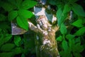 The crucifixion of Jesus Christ. Close up very old and ancient stone destroyed statue in the grass. Top view
