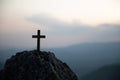 Crucifixion Of Jesus Christ - Cross At Sunset. Silhouette cross on Calvary mountain sunset background. Easter concept