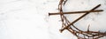 Crucifixion Of Jesus / religion easter background - Crown Of Thorns and rusty old nails on white marble marble Ground or table or Royalty Free Stock Photo