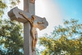 Crucifixion, statue of Jesus Christ on concrete cross on cemetery Royalty Free Stock Photo