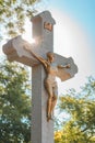 Crucifixion, statue of Jesus Christ on concrete cross on cemetery Royalty Free Stock Photo