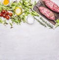 Crude kebab on a skewer with vegetables on a cutting board border ,place text wooden rustic background top view close u Royalty Free Stock Photo